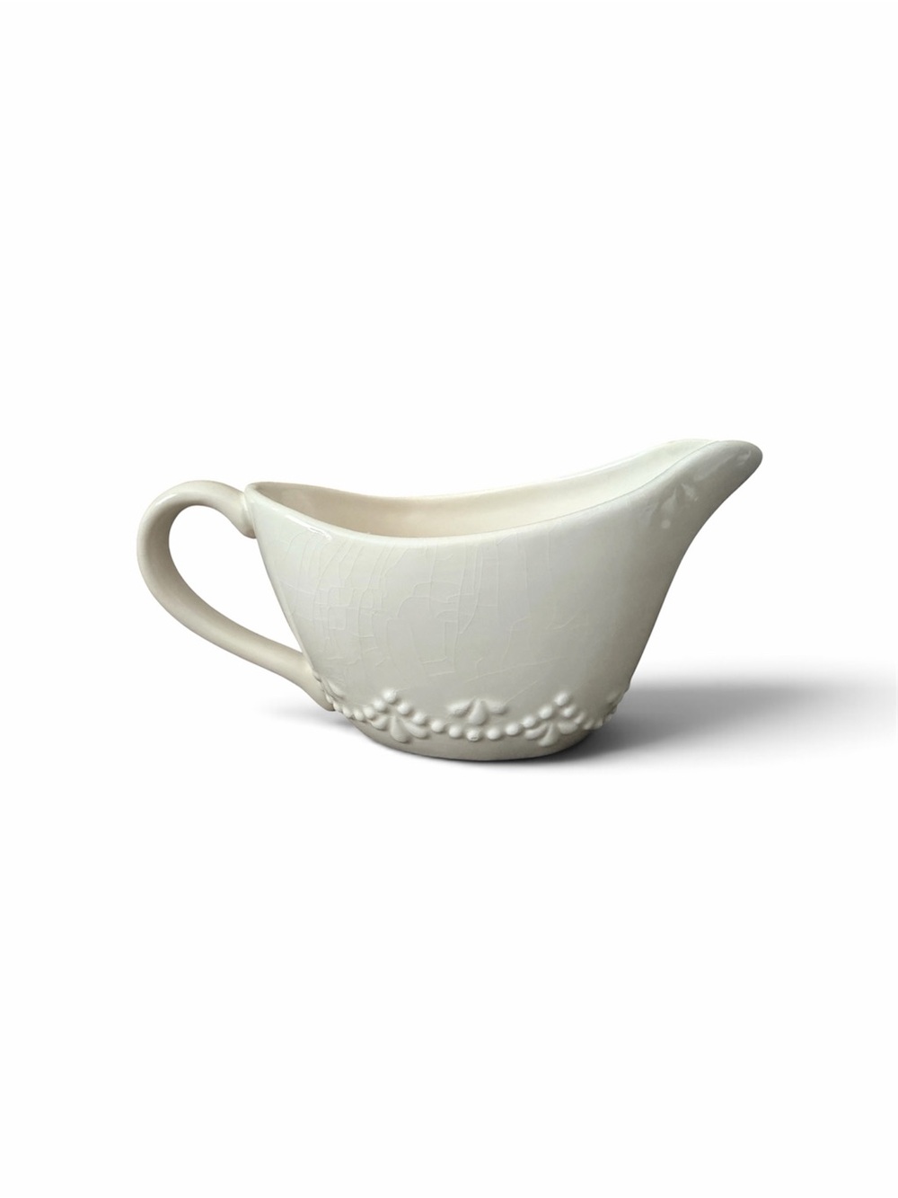 Cream Ceramic Gravy Boat with Embossed Floral Border